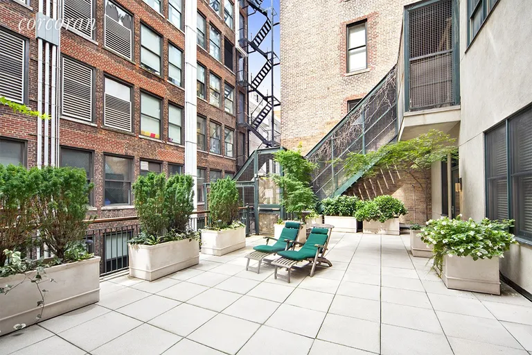 New York City Real Estate | View 136 West 22nd Street, PH1 | South Facing Rear Terrace with tranquil Fountain | View 16
