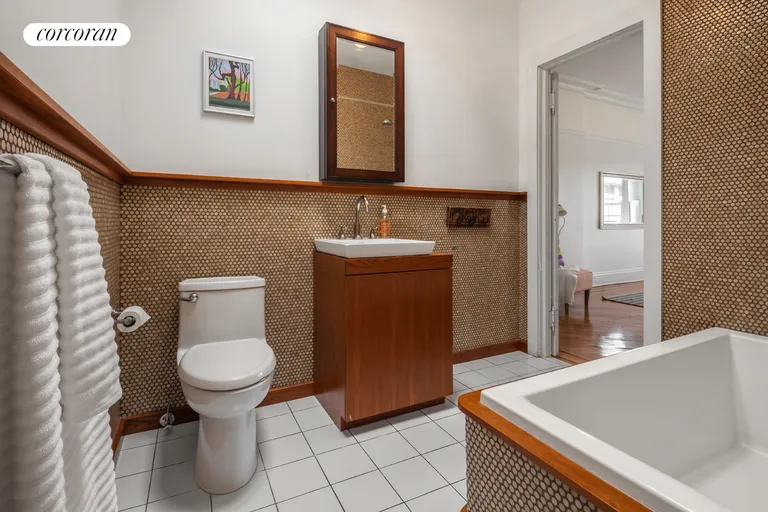 New York City Real Estate | View 158 Saint Johns Place | Crisp shared bathroom with skylight | View 16
