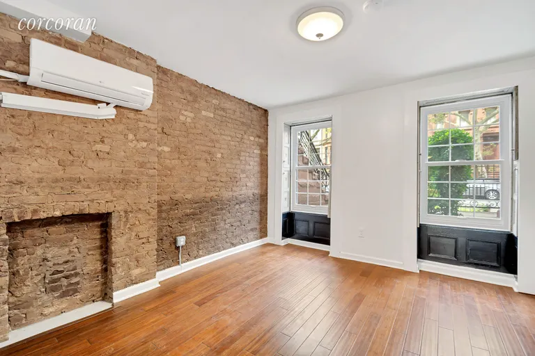 New York City Real Estate | View 832 Putnam Avenue, Garden | Spacious bedroom with exposed brick | View 4