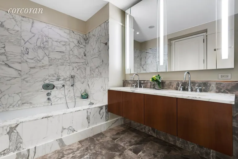 New York City Real Estate | View 25 Columbus Circle, 61B | Master bathroom with walk in shower and tub | View 8