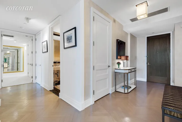 New York City Real Estate | View 25 Columbus Circle, 61B | Large entry foyer with herringbone floors | View 4