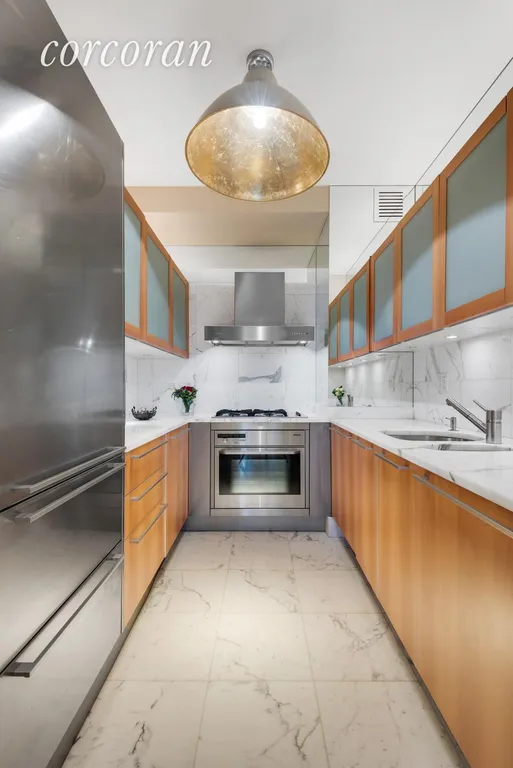 New York City Real Estate | View 25 Columbus Circle, 61B | High-end kitchen with top of the line finishes | View 5