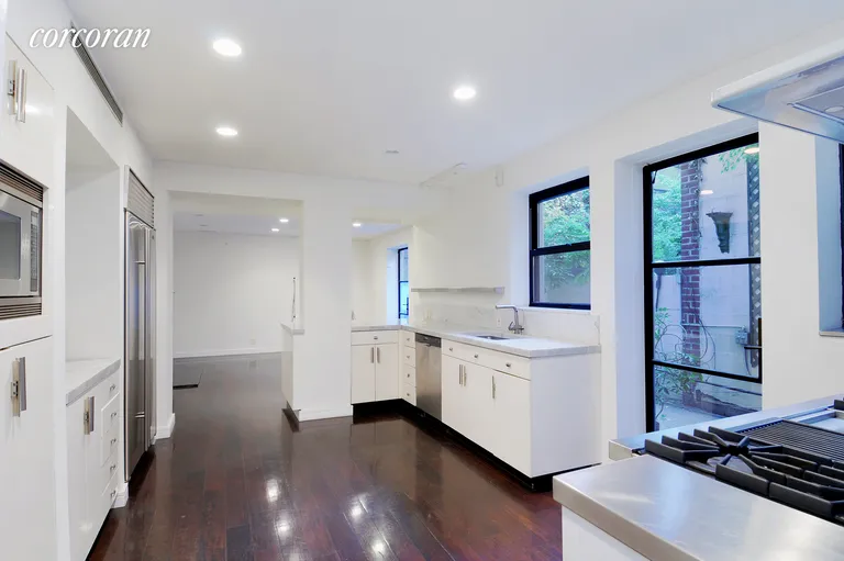 New York City Real Estate | View 107 East 37th Street, 1 | Chef's Kitchen with Family Room | View 2