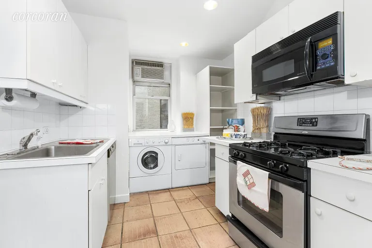 New York City Real Estate | View 125 East 72nd Street, 2C | Windowed kitchen with washer dryer | View 6
