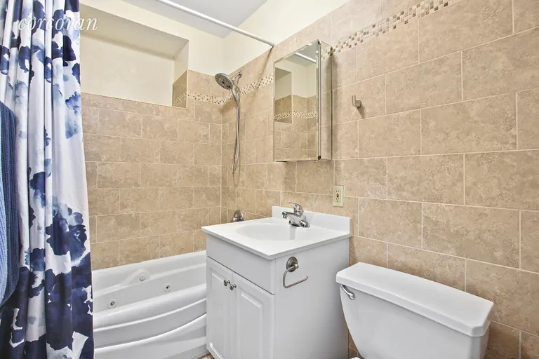 New York City Real Estate | View 313 23rd Street, 2B | Bathroom with jacuzzi tub and tons of storage! | View 5