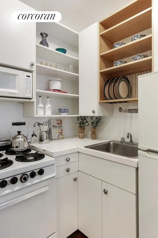 New York City Real Estate | View 134 West 81st Street, 2F | Kitchen opens to living room | View 4