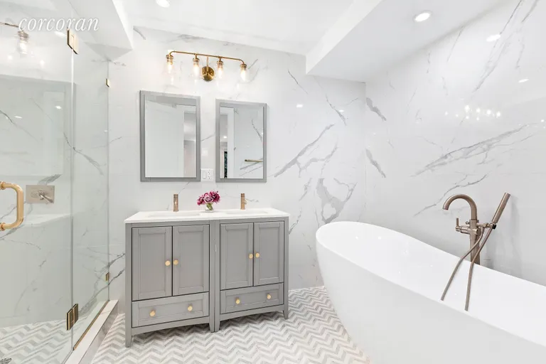 New York City Real Estate | View 249 Macon Street | Master Bathroom with deep soaking tub and shower! | View 6