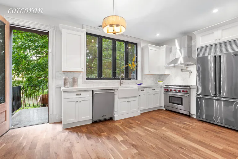 New York City Real Estate | View 249 Macon Street | Windowed Chef's kitchen with deck access! | View 3