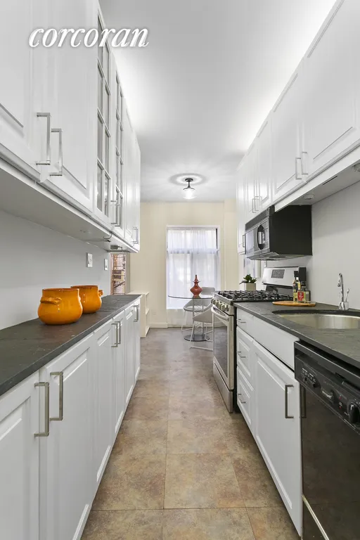 New York City Real Estate | View 22 West 76th Street, 1 | Large Galley Kitchen Overlooking Garden | View 5