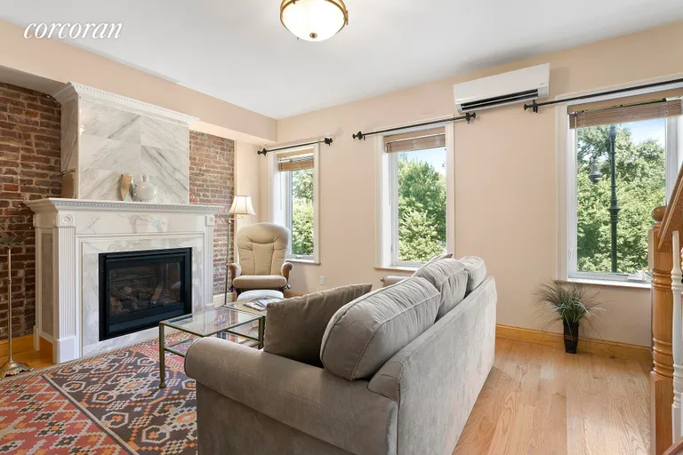 New York City Real Estate | View 205 Prospect Park SW, 2 | Lovely living room with working fireplace  | View 2