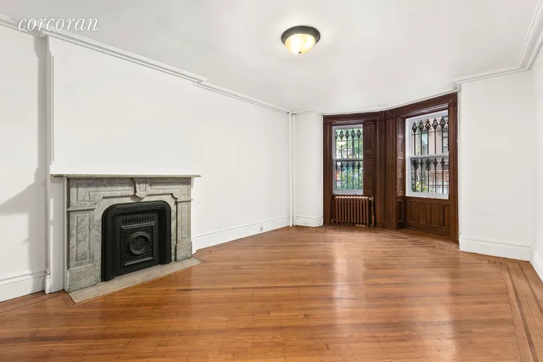 New York City Real Estate | View 130 Sixth Avenue | Garden Level Bedroom with Marble Fireplace! | View 26