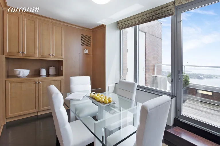 New York City Real Estate | View 10 West Street, PH2C | Eat In Kitchen with Terrace and River Views | View 13