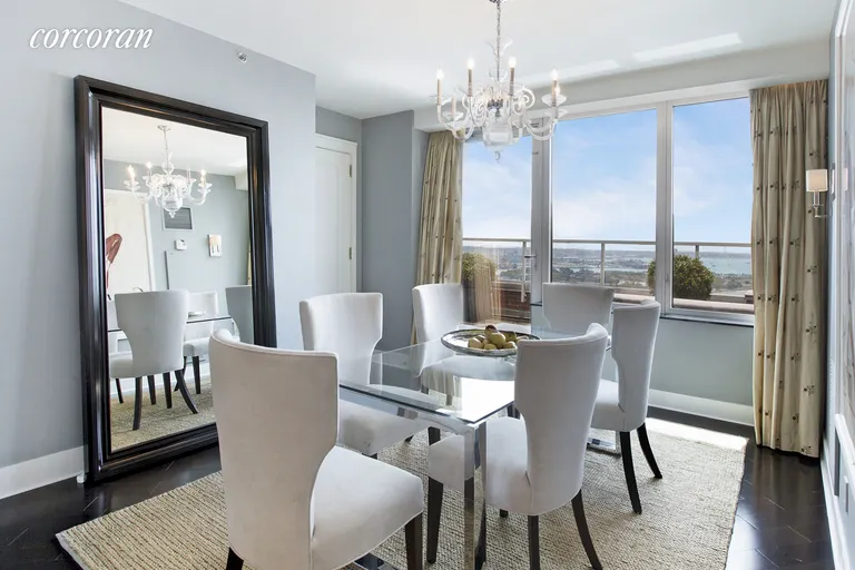 New York City Real Estate | View 10 West Street, PH2C | Dining Room with Terrace and River Views | View 4
