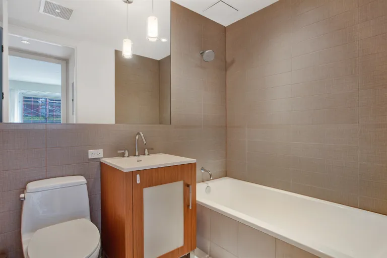 New York City Real Estate | View 125 North 10th Street, S4E | second Bath with deep soaking tub | View 6