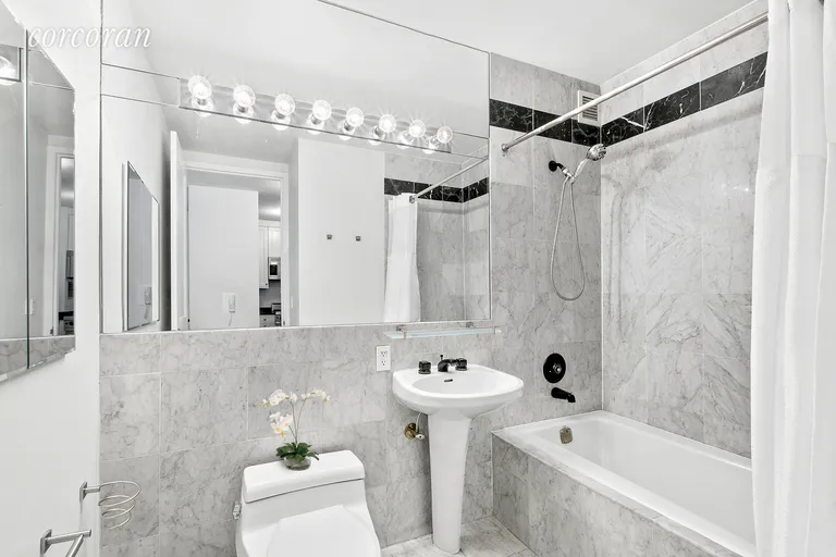 New York City Real Estate | View 155 West 70th Street, 7G | Elegant Marble Bathroom | View 4