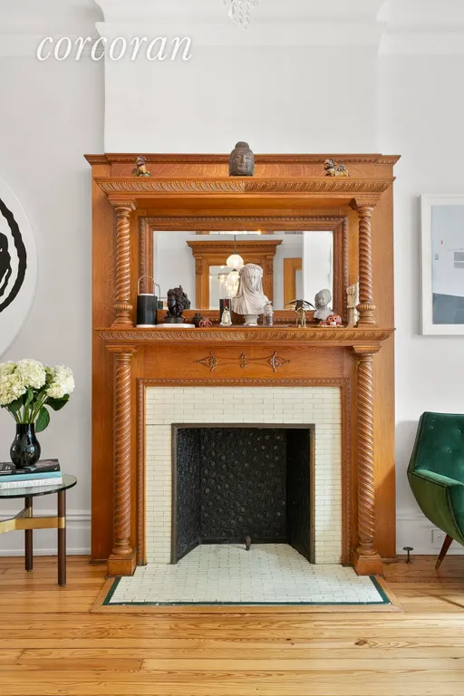 New York City Real Estate | View 393 Sterling Place | Original, ornate wood mantle | View 3