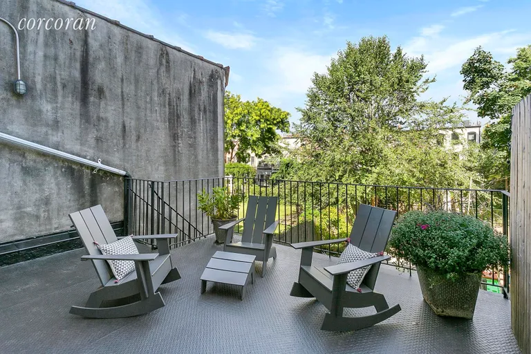 New York City Real Estate | View 393 Sterling Place | 14x17ft deck with stairs leading to garden | View 12
