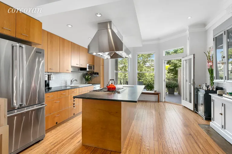New York City Real Estate | View 393 Sterling Place | Modern kitchen with huge island and breakfast bar | View 6
