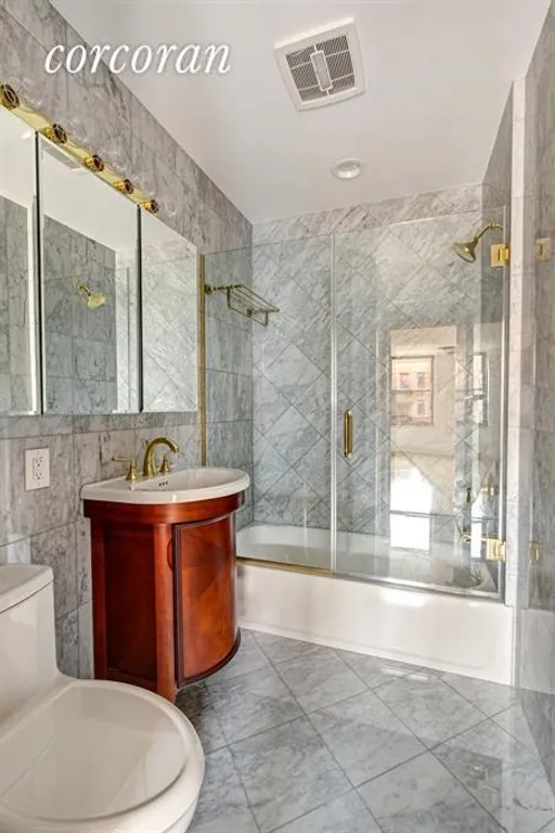 New York City Real Estate | View 110 First Avenue, 4 | Marble Bathroom with Washer/Dryer | View 4