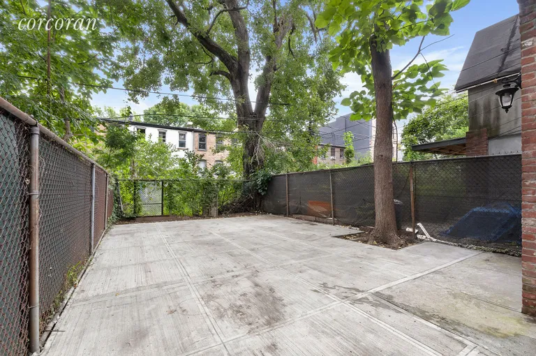 New York City Real Estate | View 285 Macon Street | Beautifully Manicured Backyard | View 7