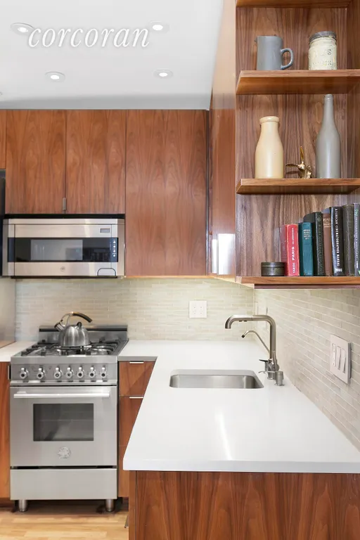 New York City Real Estate | View 250 West 15th Street, 2C | Custom walnut cabinetry | View 3
