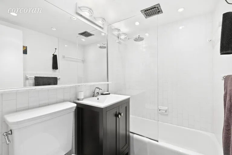 New York City Real Estate | View 250 West 15th Street, 2C | Renovated master bathroom | View 8