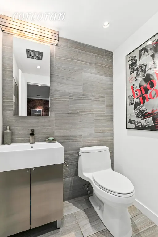 New York City Real Estate | View 250 West 15th Street, 2C | Renovated powder room | View 10