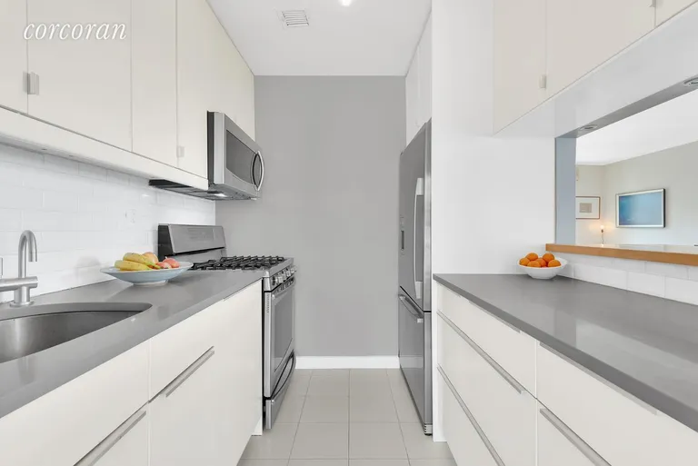 New York City Real Estate | View 42 Tiffany Place, 4A | Beautifully renovated kitchen with SS appliances | View 4