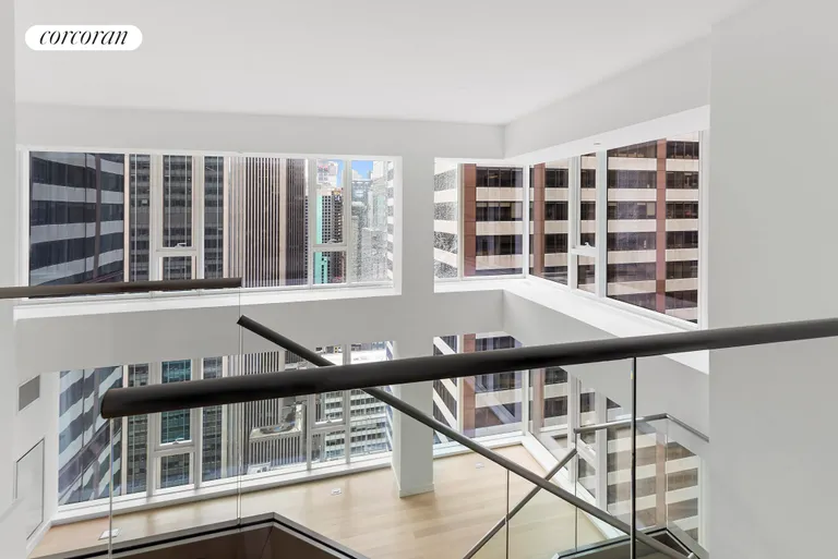 New York City Real Estate | View 135 West 52nd Street, PH3 | Double height Living Room | View 4