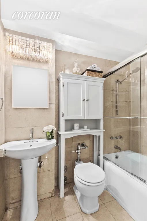 New York City Real Estate | View 32 Gramercy Park South, 5f | Renovated bathroom with storage and tub!  | View 8
