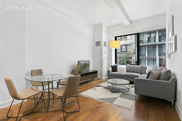New York City Real Estate | View 140 West 22Nd Street, 2A | Open and spacious living room with dining area  | View 2
