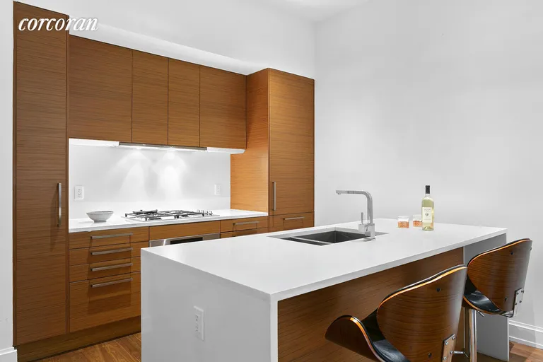 New York City Real Estate | View 140 West 22Nd Street, 2A | Modern kitchen with custom appliances  | View 3