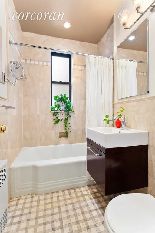 New York City Real Estate | View 30 East 9th Street, 6D | Renovated Windowed Bathroom | View 6