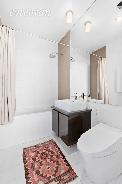 New York City Real Estate | View 315 Gates Avenue, 6B | Radiant heated floors in the bathroom | View 9
