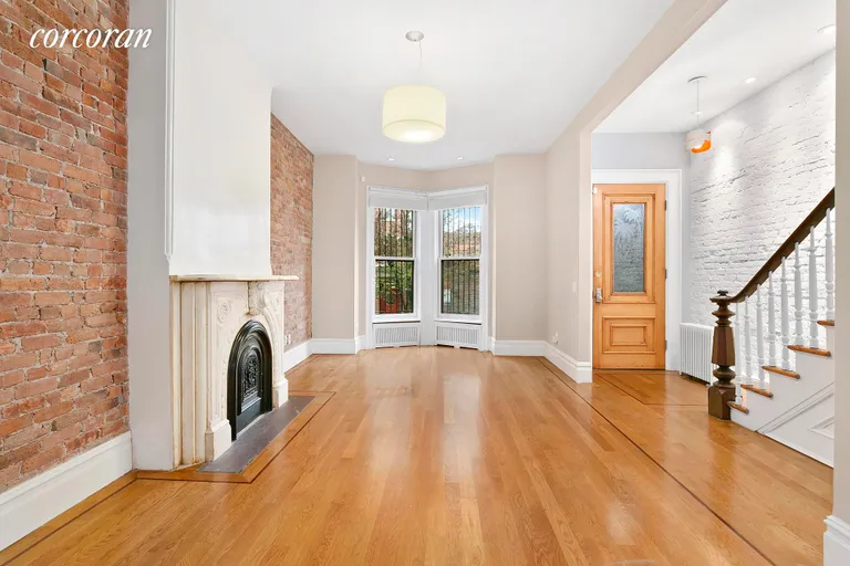 New York City Real Estate | View 274 12th Street | Parlor Level Living Area with Decorative Fireplace | View 2