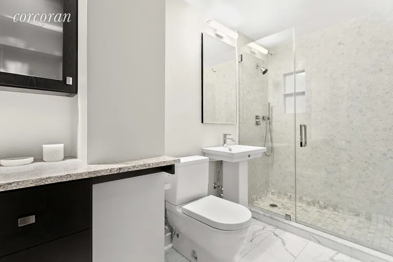 New York City Real Estate | View 75 Henry Street, 14L | Spacious bathroom with Italian marble floors | View 5