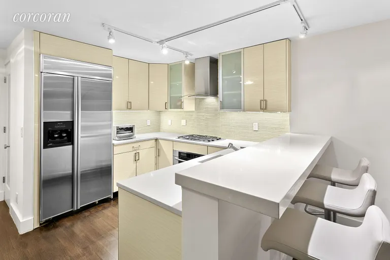 New York City Real Estate | View 75 Henry Street, 14L | Chef's kitchen with Ceasar stone counter tops | View 3