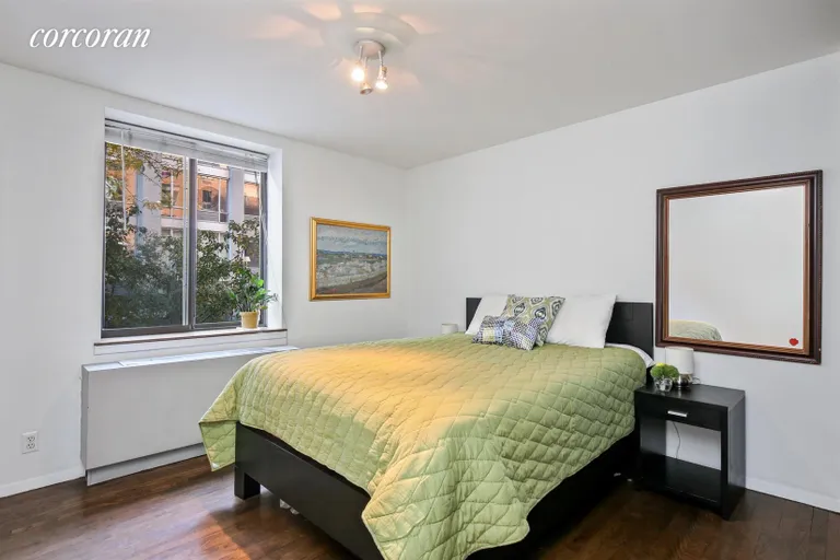 New York City Real Estate | View 445 West 19th Street, 2F | Bedroom with tree-top view | View 4
