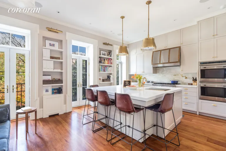 New York City Real Estate | View 219 Kane Street | Kitchen with doors to deck and garden | View 2