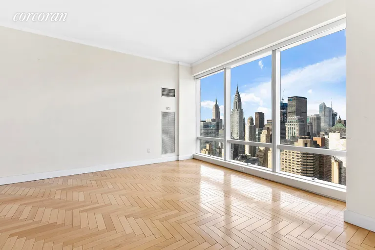 New York City Real Estate | View 845 United Nations Plaza, 53E | Living Room from Dining Room/Library/2nd BR | View 3