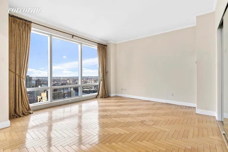 New York City Real Estate | View 845 United Nations Plaza, 53E | Master Bedroom w/West & River Views | View 8