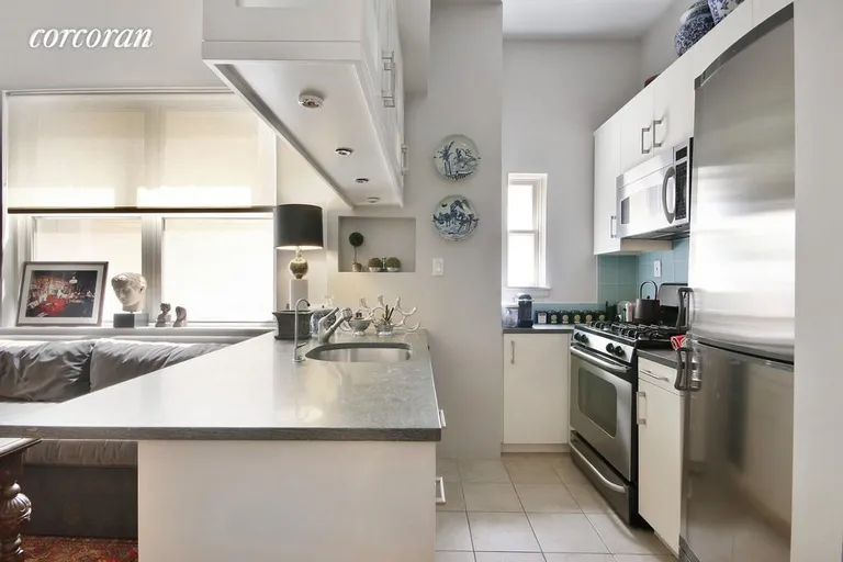 New York City Real Estate | View 16 East 80th Street, 3D | Renovated open kitchen with dishwasher | View 4