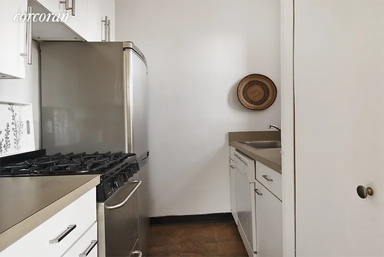 New York City Real Estate | View 104 West 70th Street, 6F | SS appliances, a dishwasher, and a window | View 3