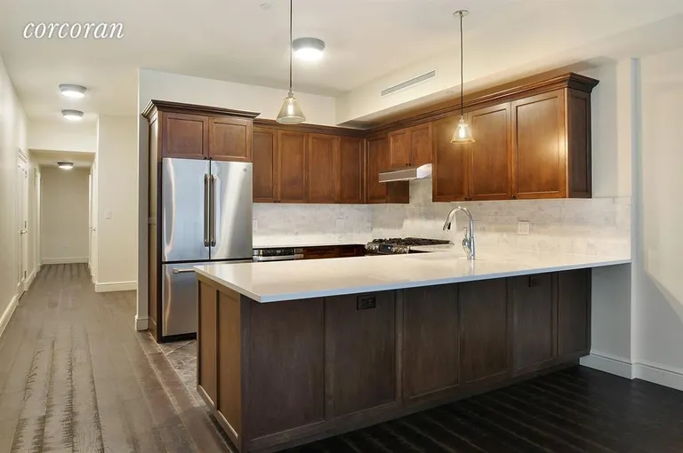 New York City Real Estate | View 34 West 22nd Street, 3rd Fl | Kitchen w/Dining Peninsula | View 3