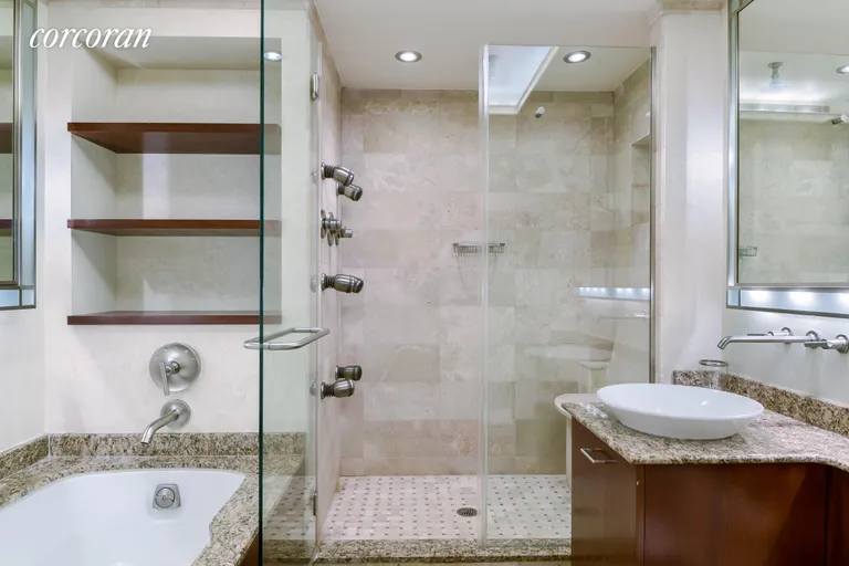 New York City Real Estate | View 721 Fifth Avenue, 59A | Renovated Bathroom with Tub and Shower | View 5