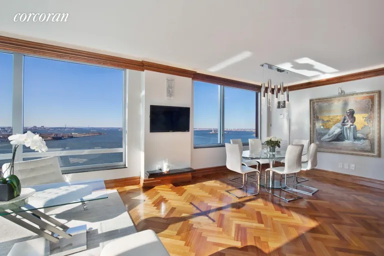 New York City Real Estate | View 10 West Street, 27E | Living Rm / Dining Rm with Direct Water Views | View 2