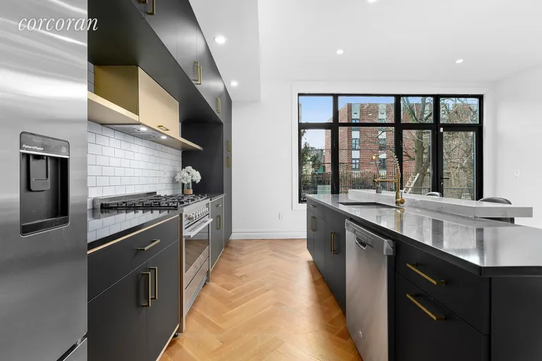 New York City Real Estate | View 372 Quincy Street | Sleek kitchen with island and ample counter space! | View 2