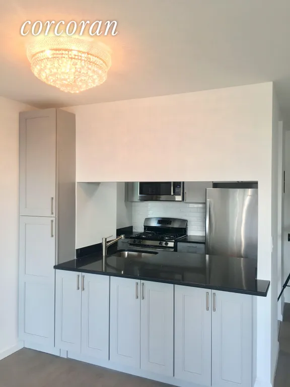 New York City Real Estate | View 235 East 40th Street, 16B | Open Kitchen with extra storage  | View 2