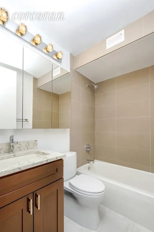 New York City Real Estate | View 235 East 40th Street, 16B | Master Bath, Second half bath in the living room | View 6