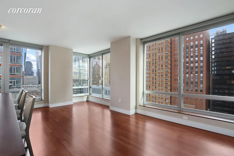 New York City Real Estate | View 30 West Street, 12B | Living Room with Floor to Ceiling Windows | View 2